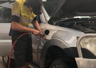 Vehicle on the hoist in the workshop bay